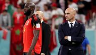 Belgium's Spanish coach Roberto Martinez watches his players from the touchline next to Belgium's forward Romelu Lukaku during the Qatar 2022 World Cup Group F football match between Belgium and Morocco at the Al Thumama Stadium in Doha on November 27, 2022. (AFP/Jack Guez)