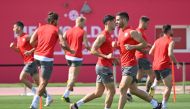 Serbia’s forward Dusan Tadic with teammates during a training session at the Al Arabi SC, yesterday. AFP