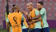 Brazil’s forward Richarlison with teammates during a training session at Al Arabi SC in Doha yesterday.