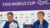 Netherlands' coach Louis Van Gaal (left) and midfielder Frenkie De Jong attend a press conference at the Qatar National Convention Center (QNCC) in Doha on November 28, 2022, on the eve of the Qatar 2022 World Cup football match between the Netherlands and Qatar. (Photo by Alberto PIZZOLI / AFP)