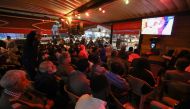 Libyans watch the Qatar 2022 World Cup Group A football match between Senegal and the Netherlands in the capital Tripoli, on November 21, 2022.  (Photo by Mahmud Turkia / AFP)