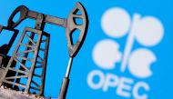 A 3D printed oil pump jack is seen in front of displayed OPEC logo in this illustration picture, April 14, 2020. File Photo / Reuters