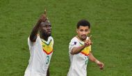 Senegal's defender Kalidou Koulibaly celebrates wit teammateIliman Ndiaye after scoring his team's second goal during the Qatar 2022 World Cup Group A match against Ecuador at the Khalifa International Stadium in Doha on November 29, 2022. (Photo by JUNG Yeon-je / AFP)
 