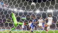 Christian Pulisic of the US scores the only goal of the FIFA World Cup Qatar 2022 Group B past Iran's Alireza Beiranvand at the Al Thumama Stadium, Doha, Qatar, on November 29, 2022. REUTERS/Kai Pfaffenbach