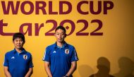 Japan's coach Hajime Moriyasu (left) and Japan's goalkeeper Shuichi Gonda pose on the green carpet ahead a press conference at the Qatar National Convention Center (QNCC) in Doha on November 30, 2022, on the eve of the Qatar 2022 World Cup football match between Japan and Spain. (Photo by Philip FONG / AFP)
 