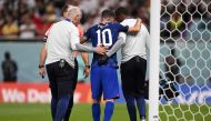 USA's Christian Pulisic receives medical attention after injuring himself while scoring his team's first goal during the Group B match against Iran at the Al-Thumama Stadium in Doha on November 29, 2022. (Photo by Fabrice COFFRINI / AFP)