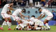 Tunisia's Wahbi Khazri celebrates scoring the only goal of the FIFA World Cup Qatar 2022 Group D match against France with teammates at the Education City Stadium, Al Rayyan, Qatar, on November 30, 2022.  REUTERS/Benoit Tessier