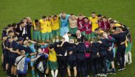 Australia coach Graham Arnold celebrates with his players and staff after qualifying for the knockout stages at Qatar World Cup 2022 Group D match against Denmark at the Al Janoub Stadium on November 30, 2022. (REUTERS/Albert Gea)