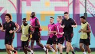 Belgium players take part in a training session at the Salwa Training Site in Salwa Beach, yesterday. AFP