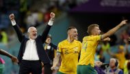 Australia coach Graham Arnold celebrates with Australia's Riley McGree and after qualifying for the knockout stages of the FIFA World Cup Qatar 2022 after defeating Denmark at the Al Janoub Stadium in Al Wakrah on November 30, 2022.  REUTERS/John Sibley