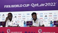 Ghana's coach Otto Addo (left) and Ghana's midfielder Thomas Partey give a press conference at the Qatar National Convention Center (QNCC) in Doha on December 1, 2022, on the eve of the Qatar 2022 World Cup football match between Ghana and Uruguay. (Photo by Khaled DESOUKI / AFP)