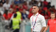 Canada's coach John Herdman walks on the pitch before the Qatar 2022 World Cup Group F football match between Canada and Morocco at the Al-Thumama Stadium in Doha on December 1, 2022. (Photo by Patrick T. Fallon / AFP)