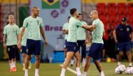 Brazil's Richarlison, Alex Telles and Fabinho during training at the  Al Arabi SC Stadium, Doha, Qatar, on December 1, 2022.  REUTERS/Amanda Perobelli