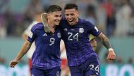 Argentina's forward #09 Julian Alvarez (L) celebrates with Argentina's midfielder #24 Enzo Fernandez after he scored his team's second goal during the Qatar 2022 World Cup Group C football match between Poland and Argentina at Stadium 974 in Doha on November 30, 2022. (Photo by JUAN MABROMATA / AFP)