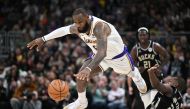 Los Angeles Lakers forward LeBron James (6) grabs the ball and jumps over Milwaukee Bucks forward Khris Middleton (22) in the second half at Fiserv Forum. Michael McLoone
