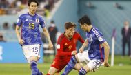  Japan’s Shogo Taniguchi in action with Spain’s Gavi