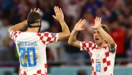 Croatia's Josko Gvardiol and Luka Modric celebrate after the match as Croatia qualify for the knockout stages of FIFA World Cup Qatar 2022 at the Ahmad Bin Ali Stadium, Al Rayyan, Qatar, on December 1, 2022.  REUTERS/Bernadett Szabo