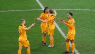 Netherlands' Virgil van Dijk, Matthijs de Ligt, Frenkie de Jong and Nathan Ake celebrates progressing to the quarter finals of FIFA World Cup Qatar 2022 at the Khalifa International Stadium, Doha, Qatar, on December 3, 2022 REUTERS/Lee Smith.