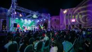 People attend a performance at Cultural Village Foundation Katara.