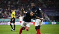 France's Kylian Mbappe celebrates scoring their third goal with Marcus Thuram during the FIFA World Cup Qatar 2022 Round of 16 match against Poland at the Al Thumama Stadium, Doha, Qatar, on December 4, 2022.  REUTERS/Dylan Martinez