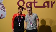 South Korea's defender Kim Jin-su and South Korea's Portuguese coach Paulo Bento ahead of a press conference at the Qatar National Convention Center (QNCC) in Doha on December 4, 2022, on the eve of the Qatar 2022 World Cup football match between Brazil and South Korea. (AFP/Pablo Porciuncula)