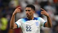 :England's midfielder #22 Jude Bellingham celebrates after qualifying to the next round by defeating Senegal 3-0 in the Qatar 2022 World Cup round of 16 football match between England and Senegal at the Al-Bayt Stadium in Al Khor, north of Doha on December 4, 2022. (Photo by Paul ELLIS / AFP)
