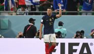 France's forward #10 Kylian Mbappe celebrates scoring his team's third goal during the Qatar 2022 World Cup round of 16 football match between France and Poland at the Al-Thumama Stadium in Doha on December 4, 2022. (Photo by ANDREJ ISAKOVIC / AFP)