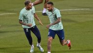 Brazil's forward Raphinha (left) and Neymar take part in a training session at the Al Arabi SC Stadium in Doha on December 4, 2022, on the eve of the Qatar 2022 World Cup football match between Brazil and South Korea. (Photo by NELSON ALMEIDA / AFP)
 