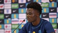 England's Bukayo Saka attends a press conference at Al Wakrah SC Stadium in Al Wakrah, south of Doha on December 5, 2022 during the Qatar 2022 World Cup football tournament. (Photo by Paul ELLIS / AFP)