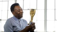 Legendary Brazilian soccer player Pele poses for a portrait with his 1958 World Cup trophy during an interview in New York, US, on April 26, 2016. File Photo / Reuters