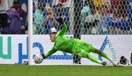 Croatia's goalkeeper Dominik Livakovic saves a shot during the Qatar 2022 World Cup round of 16 football match between Japan and Croatia at the Al-Janoub Stadium in Al-Wakrah, south of Doha on December 5, 2022. (Photo by ANDREJ ISAKOVIC / AFP)