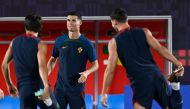 Portugal's forward #07 Cristiano Ronaldo (center) attends a training session at the Al Shahaniya SC training site, northwest of Doha on December 5, 2022, on the eve of the Qatar 2022 World Cup Round of 16 football match between Portugal and Switzerland. (Photo by PATRICIA DE MELO MOREIRA / AFP)
 