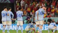 Spain's players react during the penalty shoot-out during the Qatar 2022 World Cup round of 16 football match between Morocco and Spain at the Education City Stadium in Al-Rayyan, west of Doha on December 6, 2022. (Photo by KARIM JAAFAR / AFP)