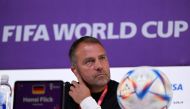 In this file photo taken on November 22, 2022 Germany's head coach Hans-Dieter Flick gives a press conference at the Qatar National Convention Center (QNCC) in Doha, on the eve of the Qatar 2022 World Cup football tournament Group E match between Germany and Japan. (Photo by Ina Fassbender / AFP)