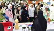 Visitors gather at a QU Health booth during the campaign.