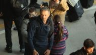 Spain's coach Luis Enrique arrives at the Adolfo Suarez Madrid-Barajas airport in the outskirts of Madrid on December 7, 2022 Photo by Thomas COEX / AFP