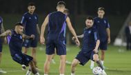 Argentina’s Angel Correa (left) and Lionel Messi (right) take part in a training session with teammates. AFP