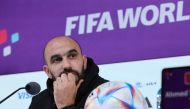 Morocco's coach Walid Regragui addresses a press conference at the Qatar National Convention Center (QNCC) in Doha on December 9, 2022, on the eve of the Qatar 2022 World Cup quarter-final football match between Morocco and Portugal. (Photo by KARIM JAAFAR / AFP)