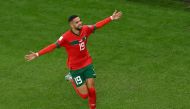 Morocco's forward #19 Youssef En-Nesyri celebrates scoring his team's first goal during the Qatar 2022 World Cup quarter-final football match between Morocco and Portugal at the Al-Thumama Stadium in Doha on December 10, 2022. (Photo by NELSON ALMEIDA / AFP)
