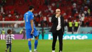 Morocco coach Walid Regragui and Yassine Bounou celebrate after the match as Morocco progress to the semi finals of the FIFA World Cup Qatar 2022 at the Al Thumama Stadium in Doha on December 10, 2022. REUTERS/Kai Pfaffenbach
