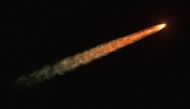 NASA's next-generation moon rocket, the Space Launch System (SLS) rocket with the Orion crew capsule, lifts off from launch complex 39-B on the unmanned Artemis 1 mission to the moon, seen from Sebastian, Florida, U.S. November 16, 2022. REUTERS/Joe Rimkus Jr.