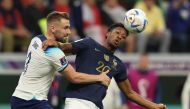 France's Kingsley Coman fights for the ball with England's Luke Shaw during the Qatar 2022 World Cup quarter-final match between England and France at the Al Bayt Stadium on December 10, 2022. (Photo by Adrian Dennis / AFP)