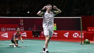 Denmark's Viktor Axelsen celebrates his victory against Indonesia's Anthony Sinisuka Ginting during the men's singles final at the HSBC BWF World Tour Finals badminton tournament in Bangkok on December 11, 2022. (Photo by Lillian SUWANRUMPHA / AFP)