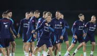 Croatia's midfielder Luka Modric (centre) takes part with his team in a training session in Doha on December 11, 2022. (Photo by JACK GUEZ / AFP)