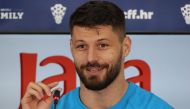 Croatia's forward Bruno Petkovic speaks during a press conference in Doha on December 11, 2022, ahead of their Qatar 2022 World Cup football semi-final match against Argentina. (Photo by JACK GUEZ / AFP)