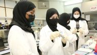 A group of QU students working in the laboratory. 