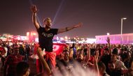 Fans enjoy at the FIFA Fan Festival at Al Bidda Park in Doha. REUTERS