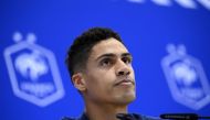 France's defender Raphael Varane gives a press conference at the Jassim-bin-Hamad Stadium in Doha on December 12, 2022, in the build-up to the Qatar 2022 World Cup semi final football match between France and Morocco. (Photo by FRANCK FIFE / AFP)