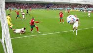 Morocco’s Youssef En-Nesyri scores against Portugal during their quarter-final match at Al Thumama Stadium, on Saturday. REUTERS