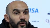 Morocco's coach Walid Regragui speaks during a press conference in Doha on December 13, 2022, a day ahead of the Qatar 2022 World Cup football semi-final match against France. (Photo by KARIM JAAFAR / AFP)